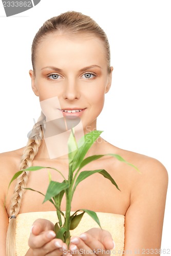 Image of woman with green sprout