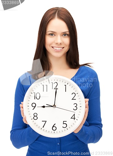 Image of woman holding big clock