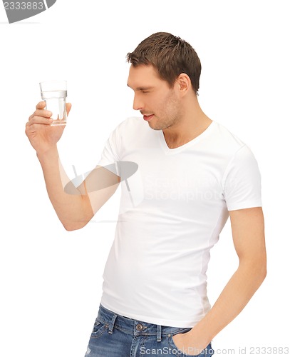 Image of man in white shirt with glass of water