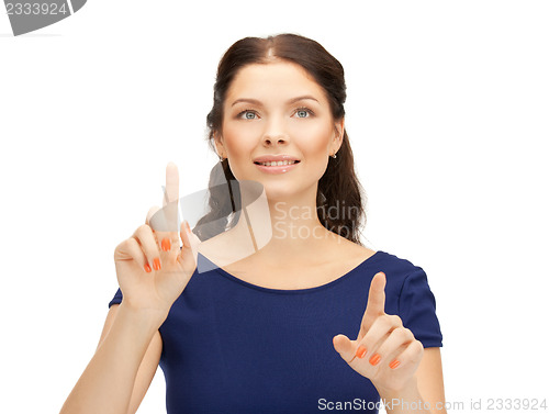 Image of businesswoman working with something imaginary