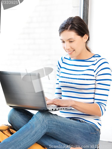 Image of happy teenage girl with laptop computer