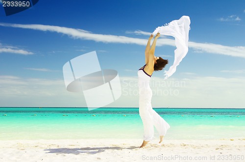 Image of happy woman with white sarong