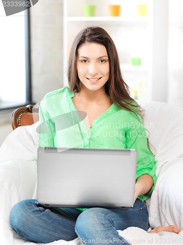 Image of happy woman with laptop computer