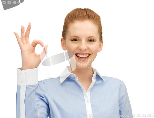 Image of young woman showing ok sign