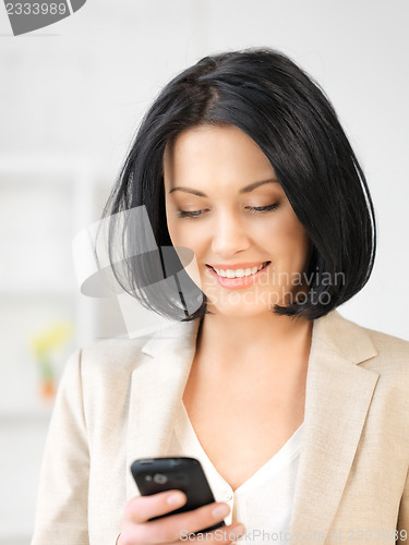 Image of businesswoman with cell phone