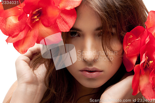 Image of lovely woman with red flowers