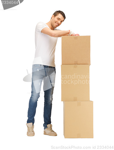 Image of handsome man with big boxes