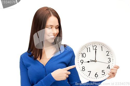 Image of woman holding big clock