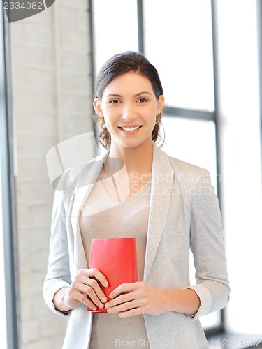 Image of happy and smiling woman with book