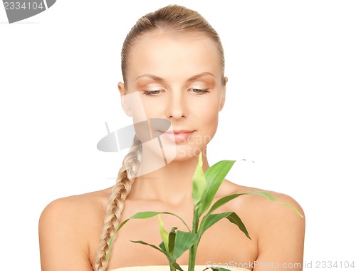 Image of woman with green sprout