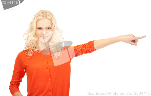 Image of attractive student pointing her finger