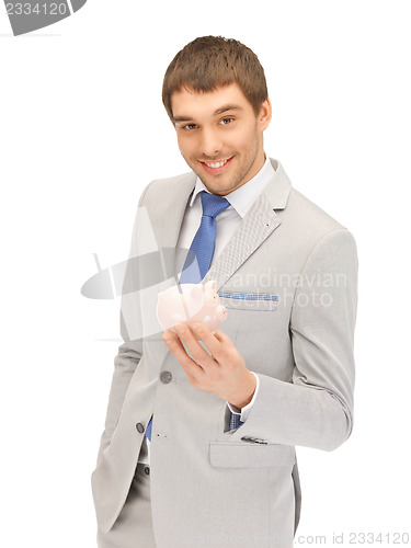 Image of man with piggy bank