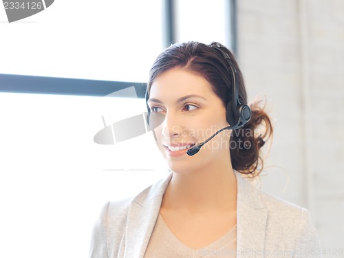 Image of friendly female helpline operator