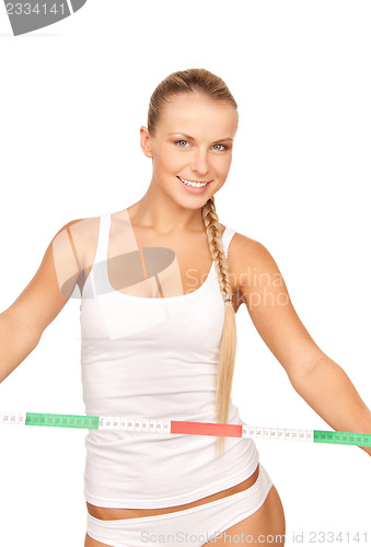 Image of young beautiful woman with measure tape