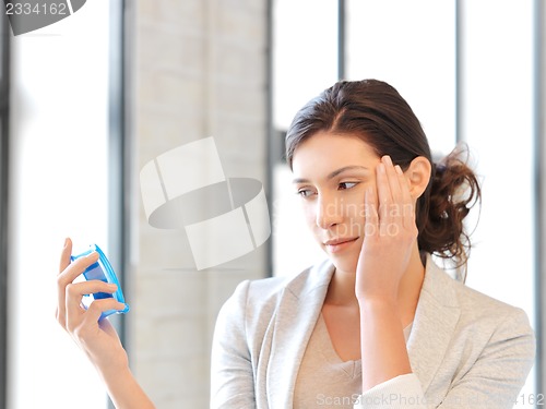 Image of businesswoman with clock