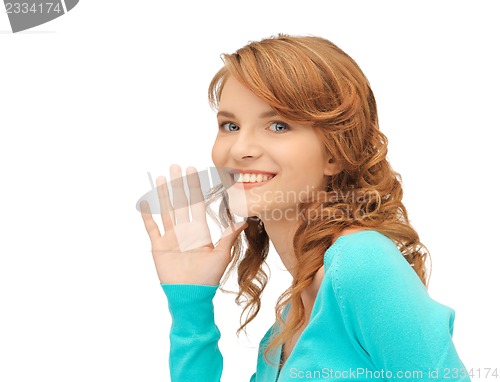 Image of teenage girl whispering gossip