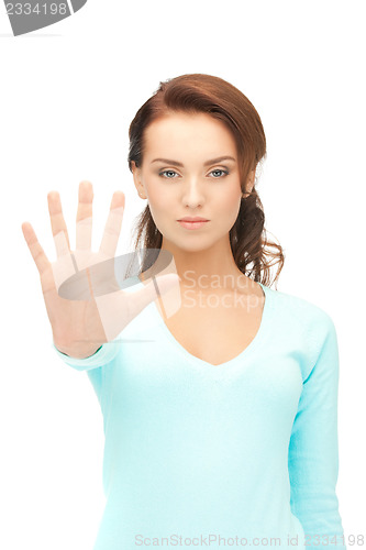 Image of woman making stop gesture