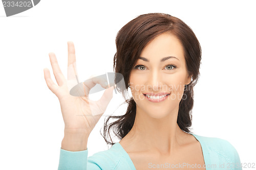 Image of young woman showing ok sign