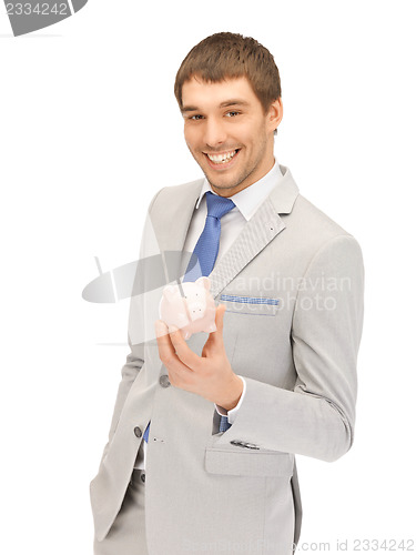 Image of man with piggy bank