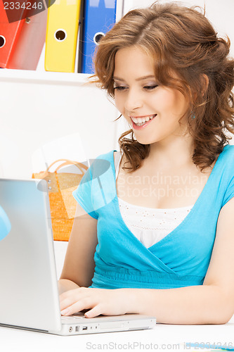 Image of happy woman with laptop computer