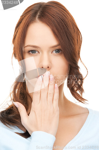 Image of woman with hand over mouth