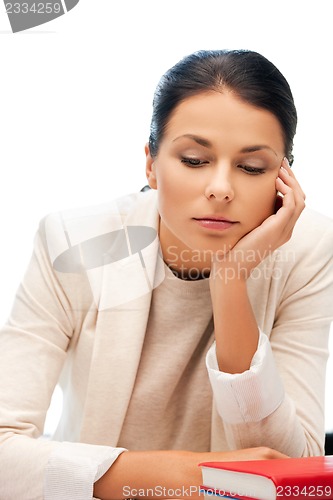 Image of calm woman with book