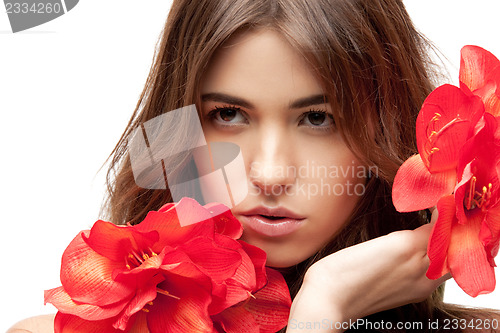 Image of lovely woman with red flowers