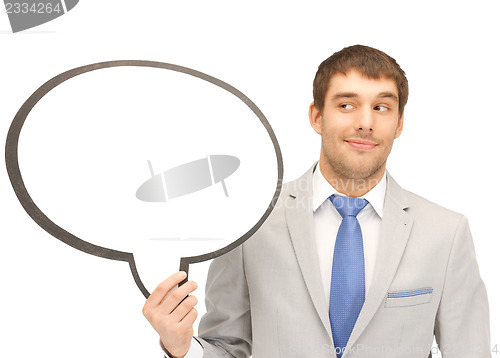 Image of smiling businessman with blank text bubble