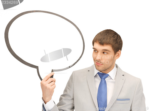 Image of smiling businessman with blank text bubble