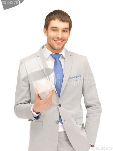 Image of man with piggy bank