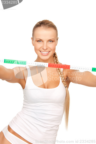 Image of young beautiful woman with measure tape