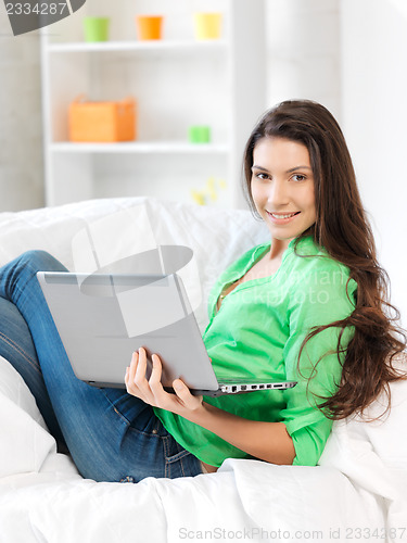 Image of happy woman with laptop computer