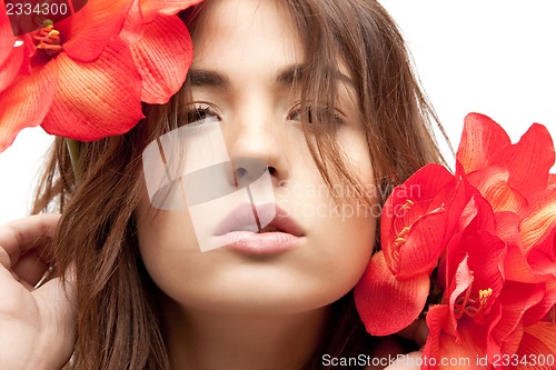 Image of lovely woman with red flowers
