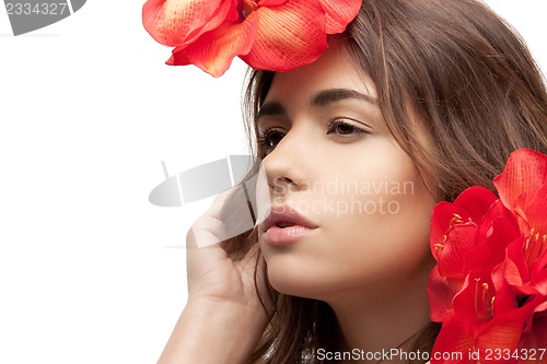 Image of lovely woman with red flowers