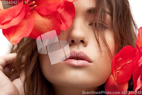 Image of lovely woman with red flowers