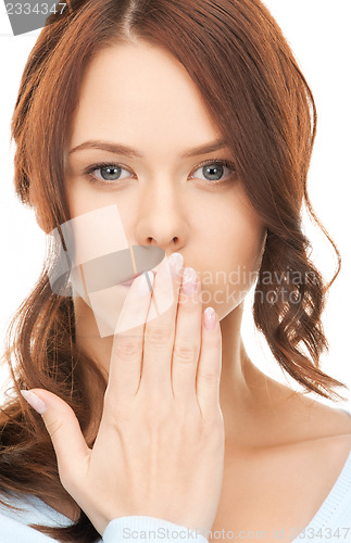 Image of woman with hand over mouth