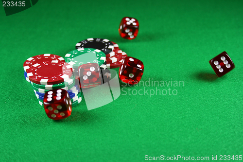 Image of An Action shot of 5 dice thrown onto the table