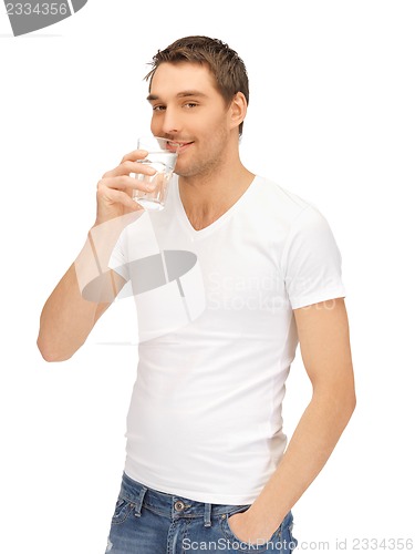 Image of man in white shirt with glass of water