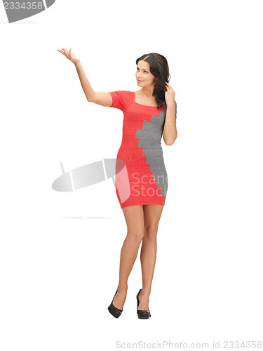 Image of woman in elegant dress showing direction