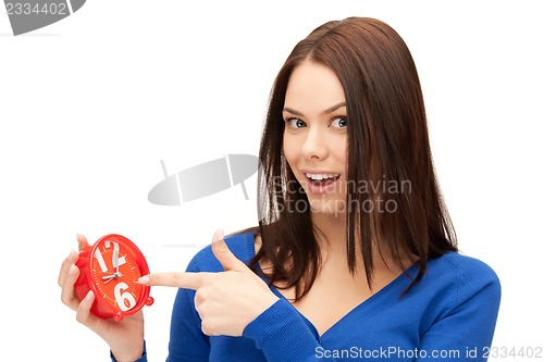 Image of woman holding alarm clock