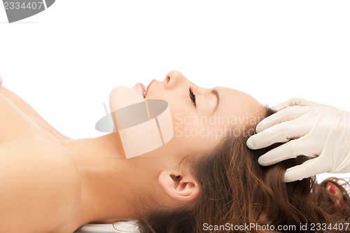 Image of beautiful woman in massage salon