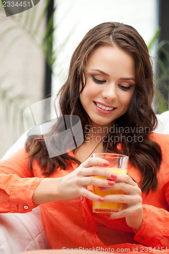 Image of beautiful woman with glass of juice