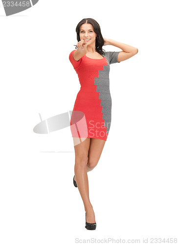 Image of woman in elegant dress pointing her finger