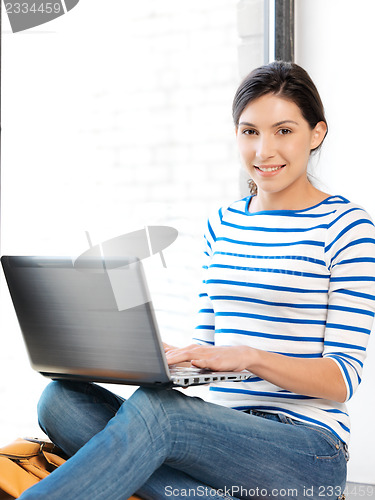 Image of happy teenage girl with laptop computer