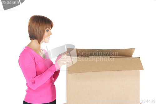Image of attractive businesswoman with cardboard box
