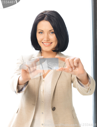 Image of happy woman with credit card