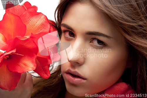 Image of lovely woman with red flowers