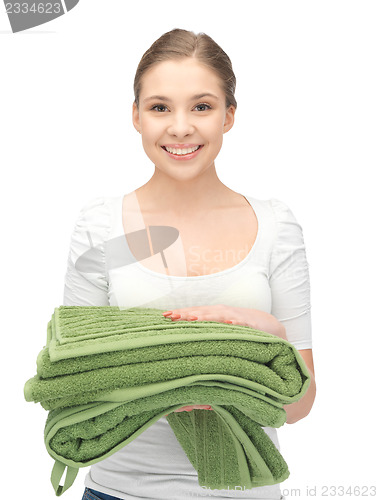 Image of lovely housewife with towels