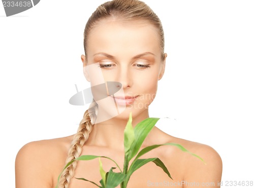 Image of woman with green sprout