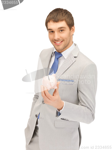 Image of man with piggy bank